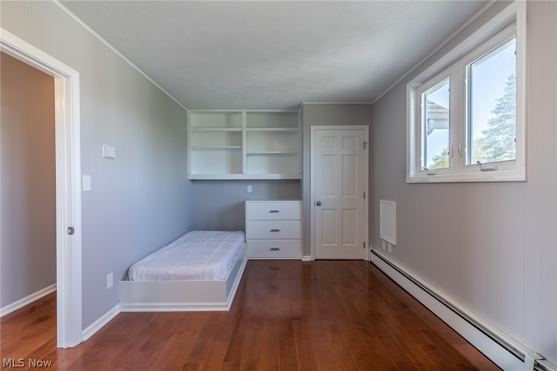 7585 Branch Road Medina, OH 44256 - Photo 27 of 35 This is one half of one of the 2nd floor bedrooms in the main house. It has new wood floors, new windows, new twin built-in beds, built-in shelves and dressers and two closets. What an awesome room for kids!!