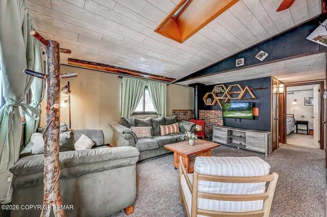 a kitchen with stainless steel appliances granite countertop a stove a sink dishwasher and cabinets with wooden floor