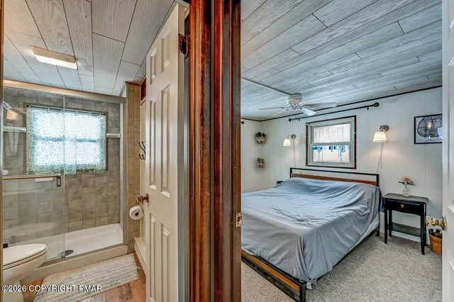 a view of a dining room with furniture wooden floor and chandelier