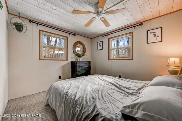 a bathroom with a toilet sink and shower