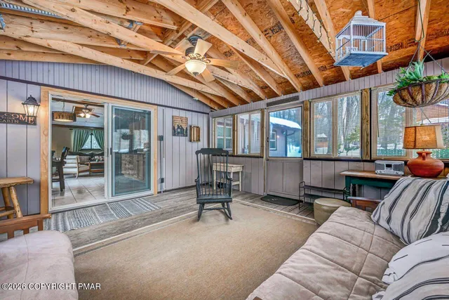 a bedroom with a bed and a large mirror