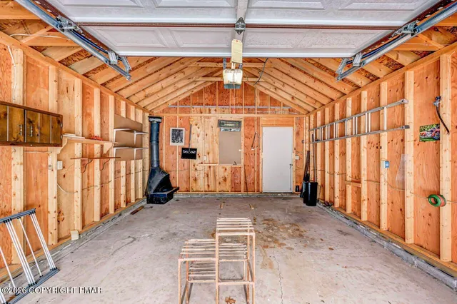 a view of a house with a snow in the yard