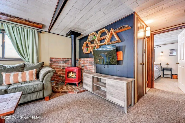 a living room with furniture and a clock