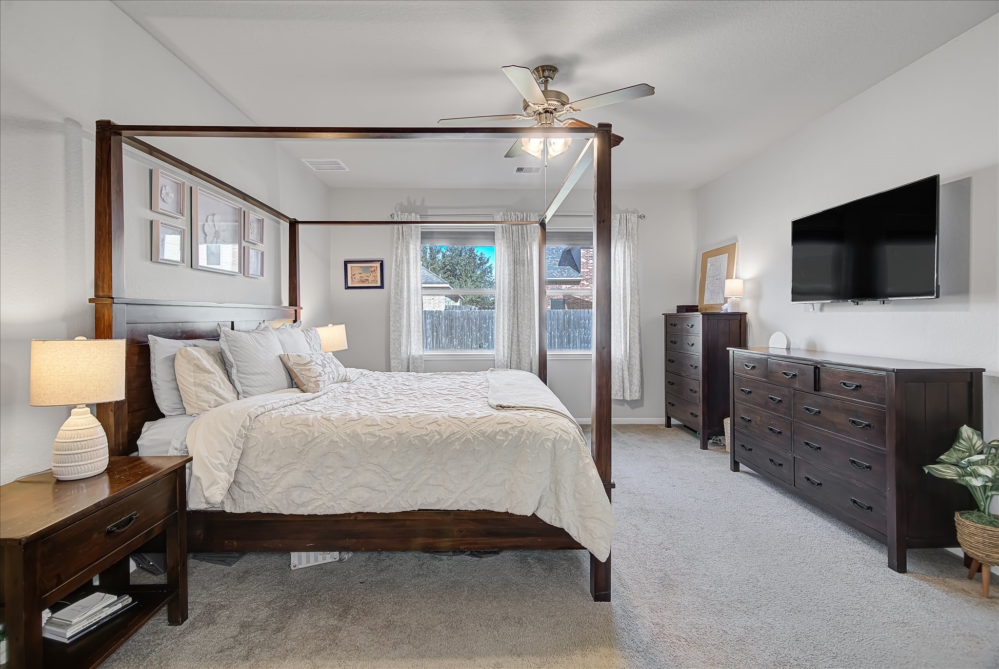 6014 Prince Place Drive Rosenberg, TX 77471 - Photo 11 of 28 The first-floor primary bedroom offers a quiet retreat with soft carpet, generous space, and privacy from the rest of the home.