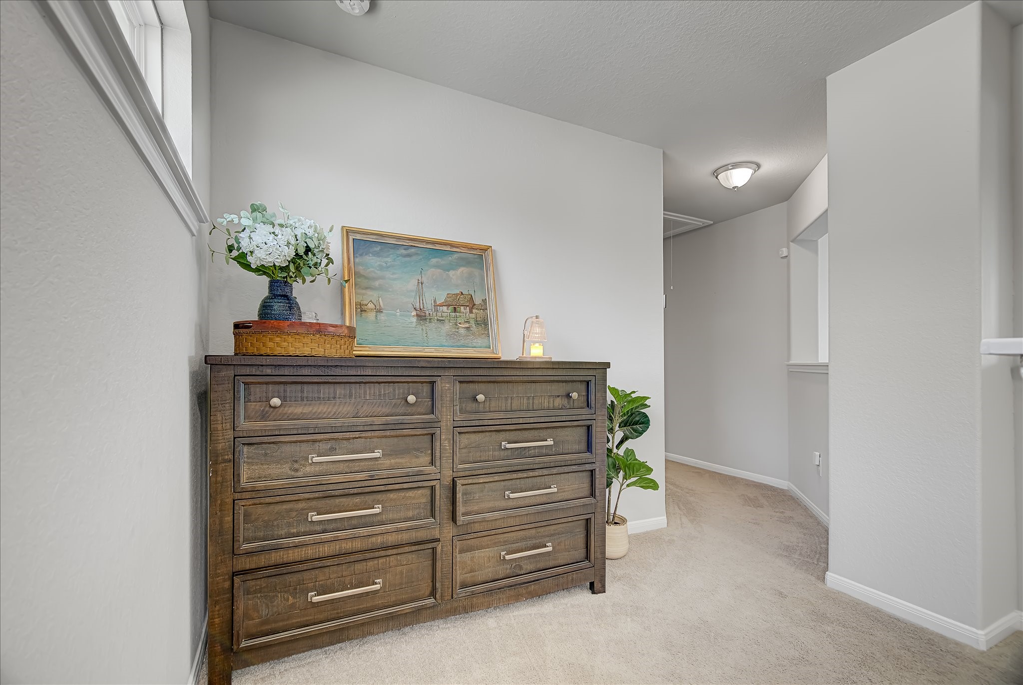6014 Prince Place Drive Rosenberg, TX 77471 - Photo 15 of 28 The upstairs landing offers a versatile space that works well as a reading nook or extra flex space between bedrooms.