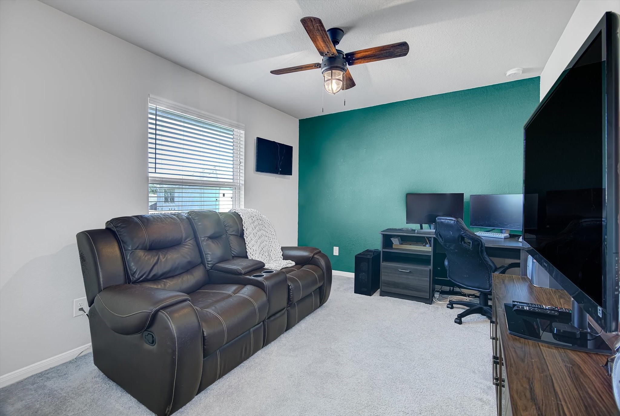 6014 Prince Place Drive Rosenberg, TX 77471 - Photo 19 of 28 Bedroom four provides flexible living space with room for a media setup, playroom, or guest retreat, offering versatility to fit a variety of needs.