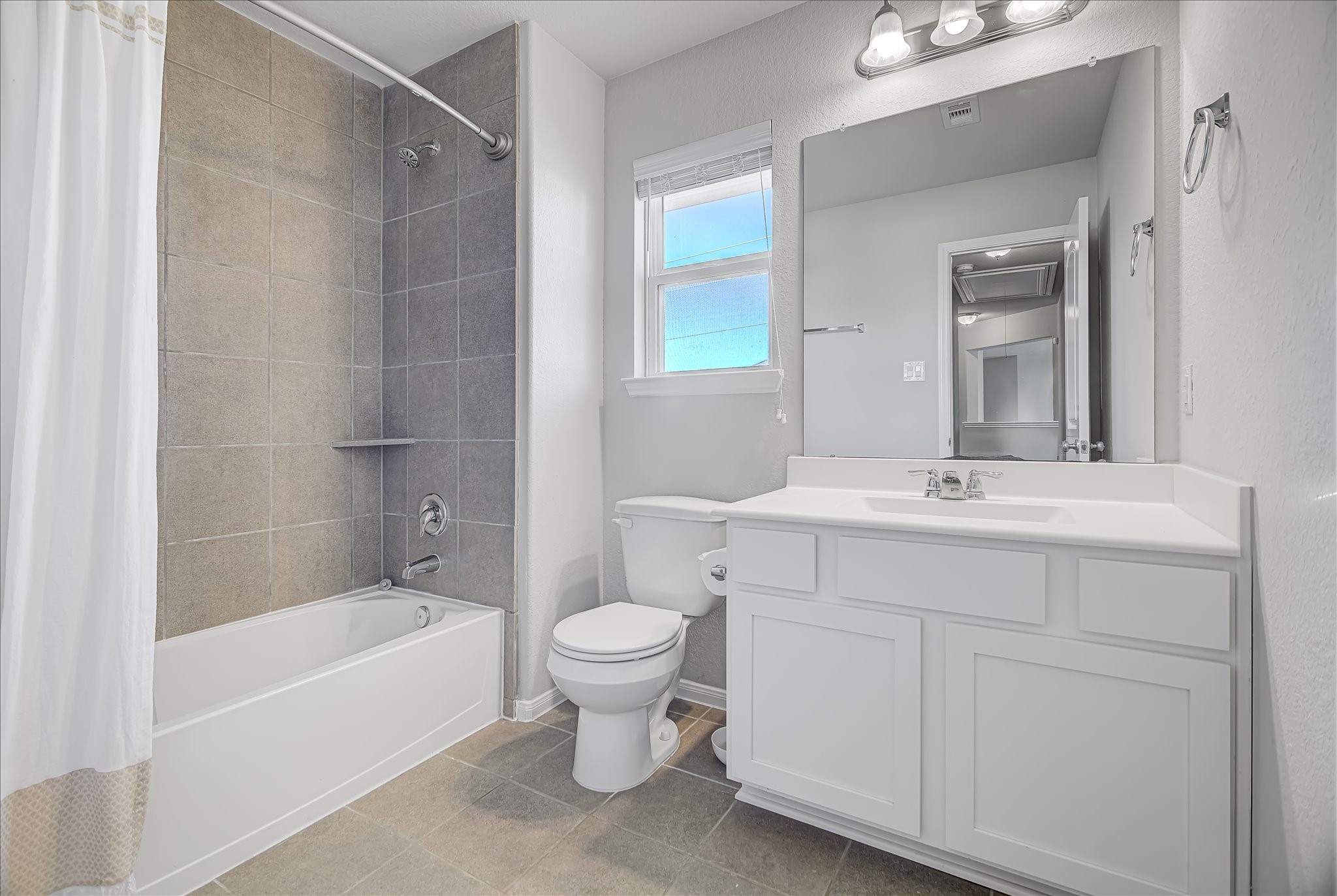 6014 Prince Place Drive Rosenberg, TX 77471 - Photo 20 of 28 The upstairs bathroom includes a tub and shower combo, clean finishes, and plenty of counter space for everyday routines.