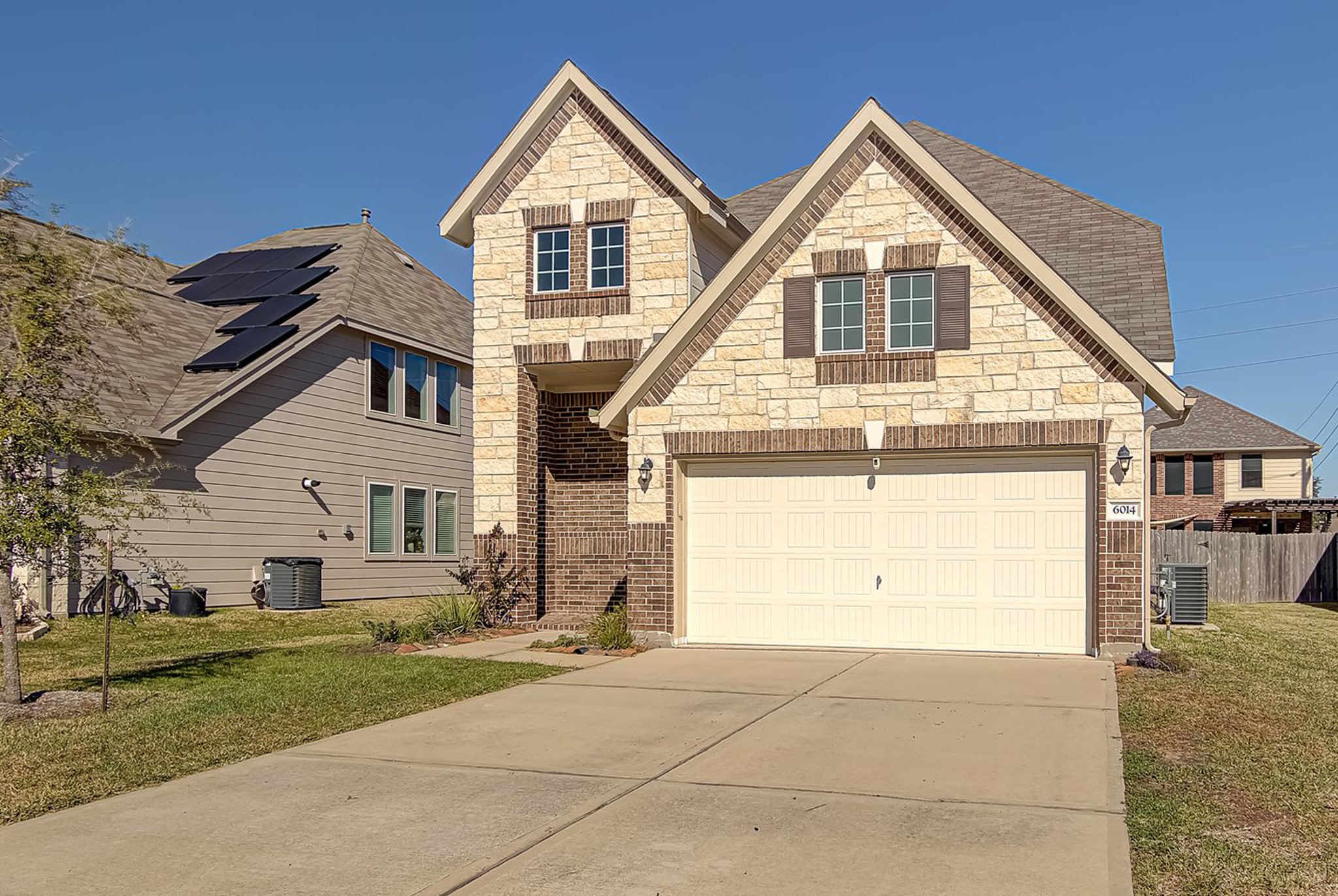 6014 Prince Place Drive Rosenberg, TX 77471 - Photo 2 of 28 The front of the home offers great curb appeal with clean lines, a soft neutral color palette, and a spacious driveway leading to the two-car garage.