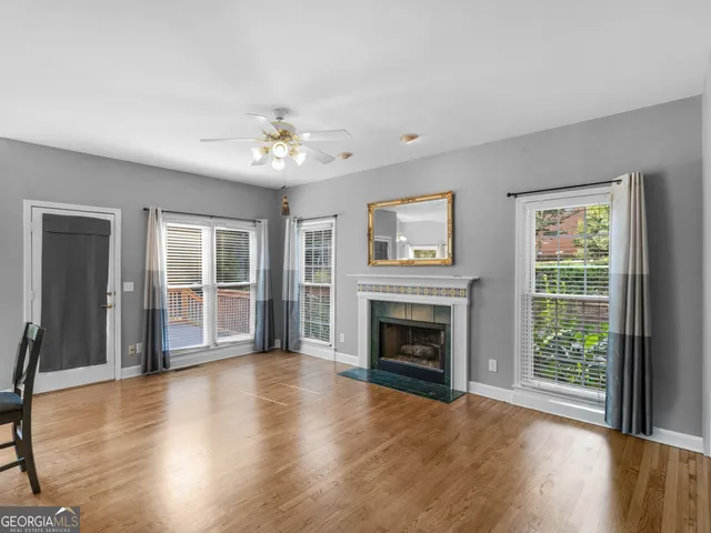 a view of a hallway view with wooden floor and staircase