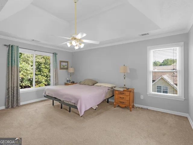 a bathroom with a granite countertop sink a mirror and a shower