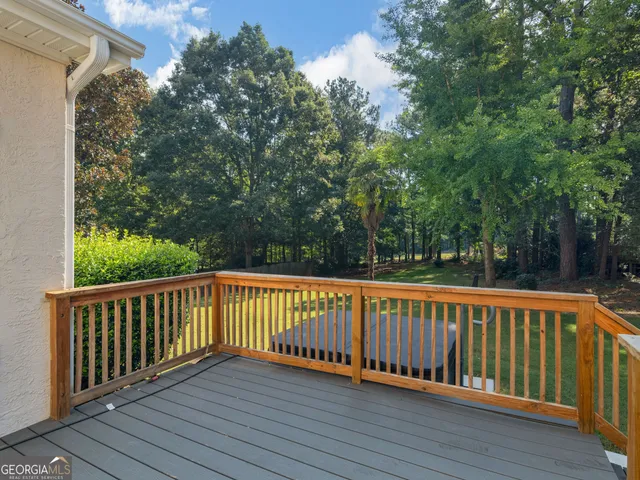 a view of a house with a yard and plants
