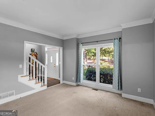 a view of an empty room with a window