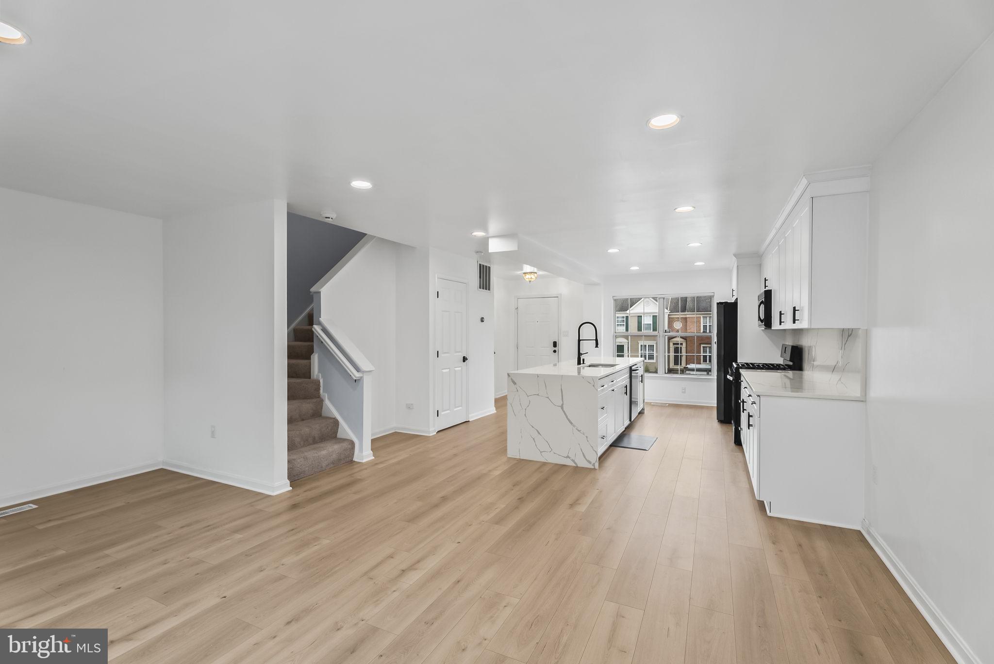1989 Bowline Loop Woodbridge, VA 22192 - Photo 11 of 30 a view of kitchen with refrigerator microwave and wooden floor