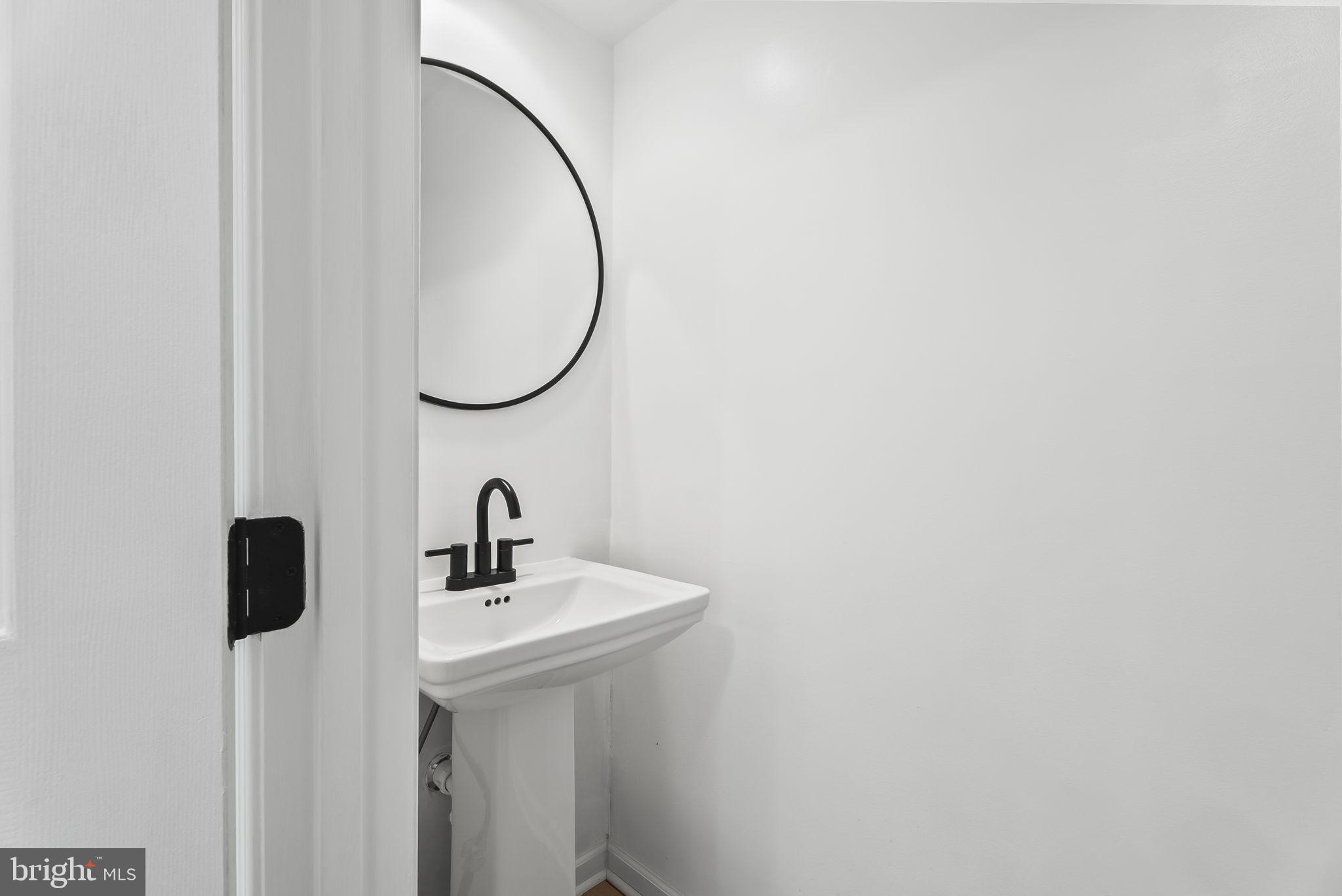 1989 Bowline Loop Woodbridge, VA 22192 - Photo 12 of 30 a bathroom with a sink and a mirror