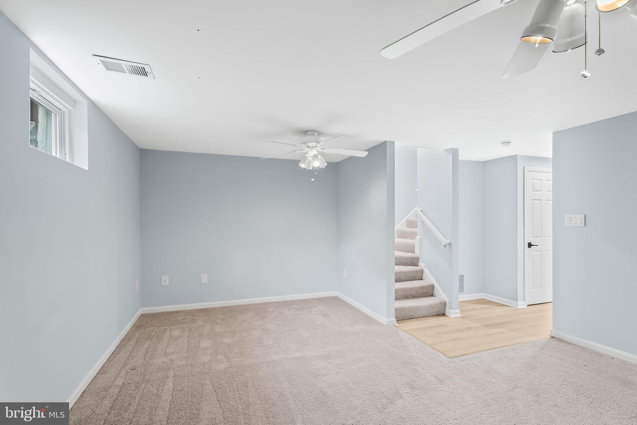 1989 Bowline Loop Woodbridge, VA 22192 - Photo 20 of 30 a view of an empty room with a ceiling fan