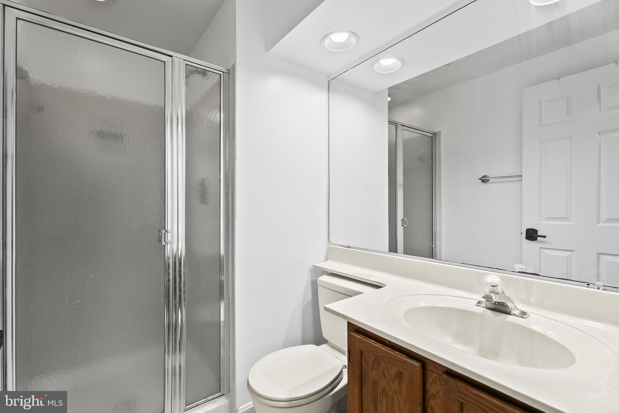 1989 Bowline Loop Woodbridge, VA 22192 - Photo 24 of 30 a bathroom with a sink toilet and shower