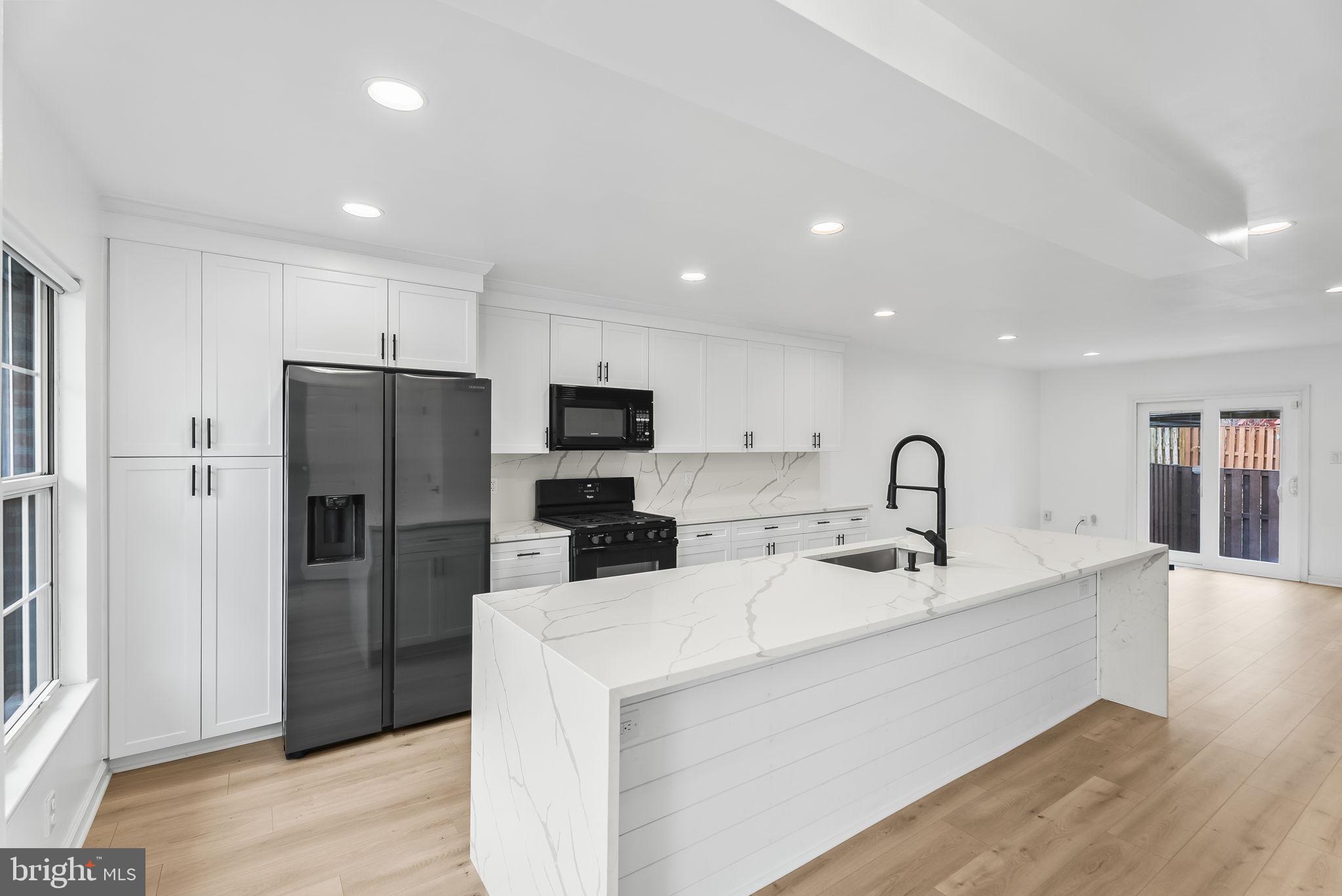 1989 Bowline Loop Woodbridge, VA 22192 - Photo 9 of 30 a kitchen with refrigerator and cabinets