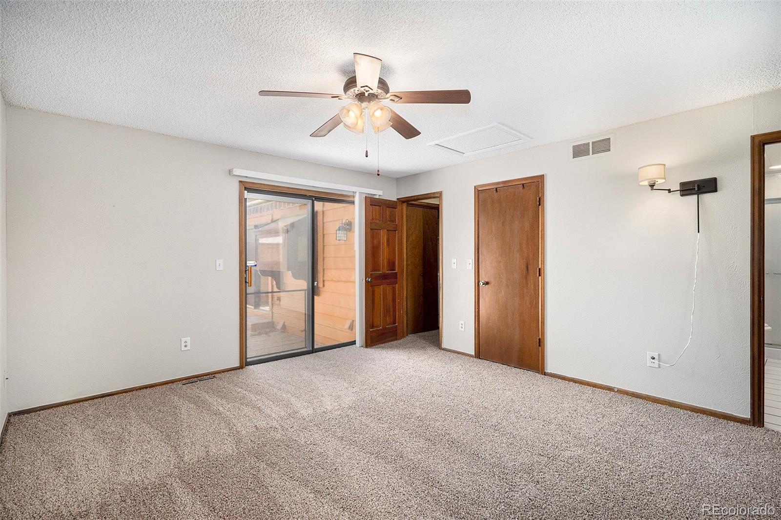 136 South Eagle Circle Aurora, CO 80012 - Photo 15 of 23 a view of an empty room with a window
