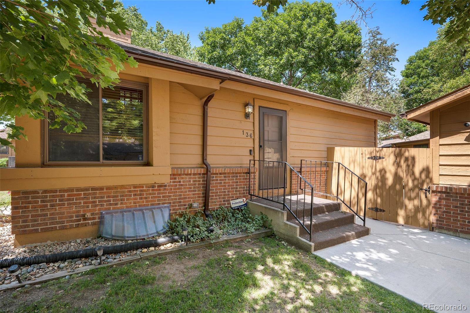 136 South Eagle Circle Aurora, CO 80012 - Photo 2 of 23 a view of a backyard with a sink