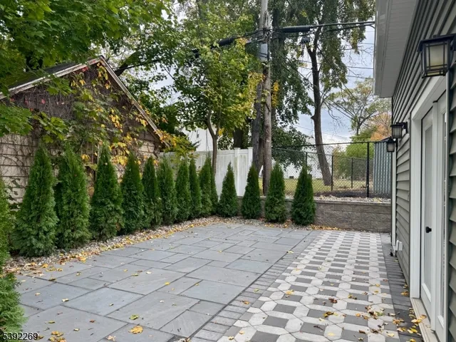 a view of a pathway with a yard