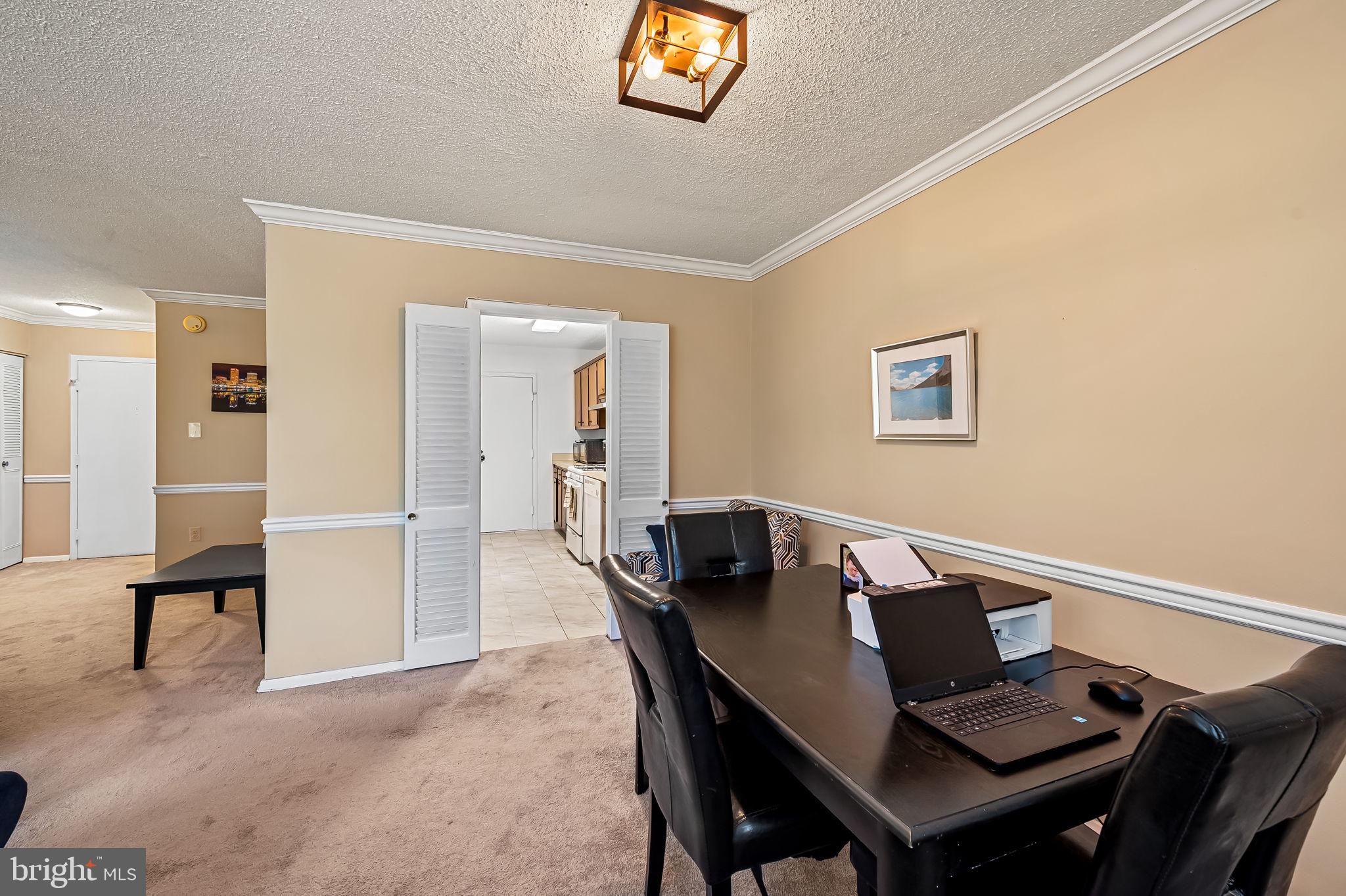 4401 Roland Avenue, Unit 110 Baltimore, MD 21210 - Photo 12 of 23 a view of a workspace with furniture