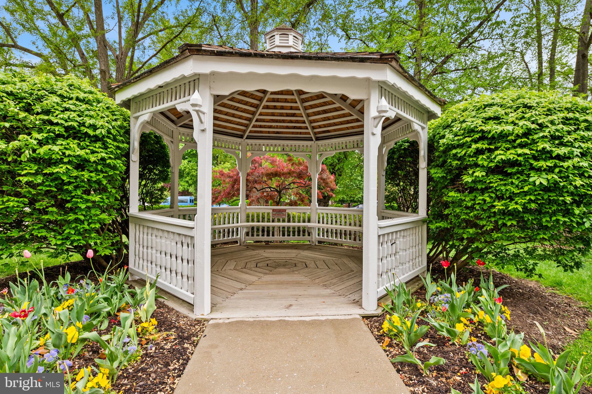 4401 Roland Avenue, Unit 110 Baltimore, MD 21210 - Photo 21 of 23 a view of a porch with plants and garden