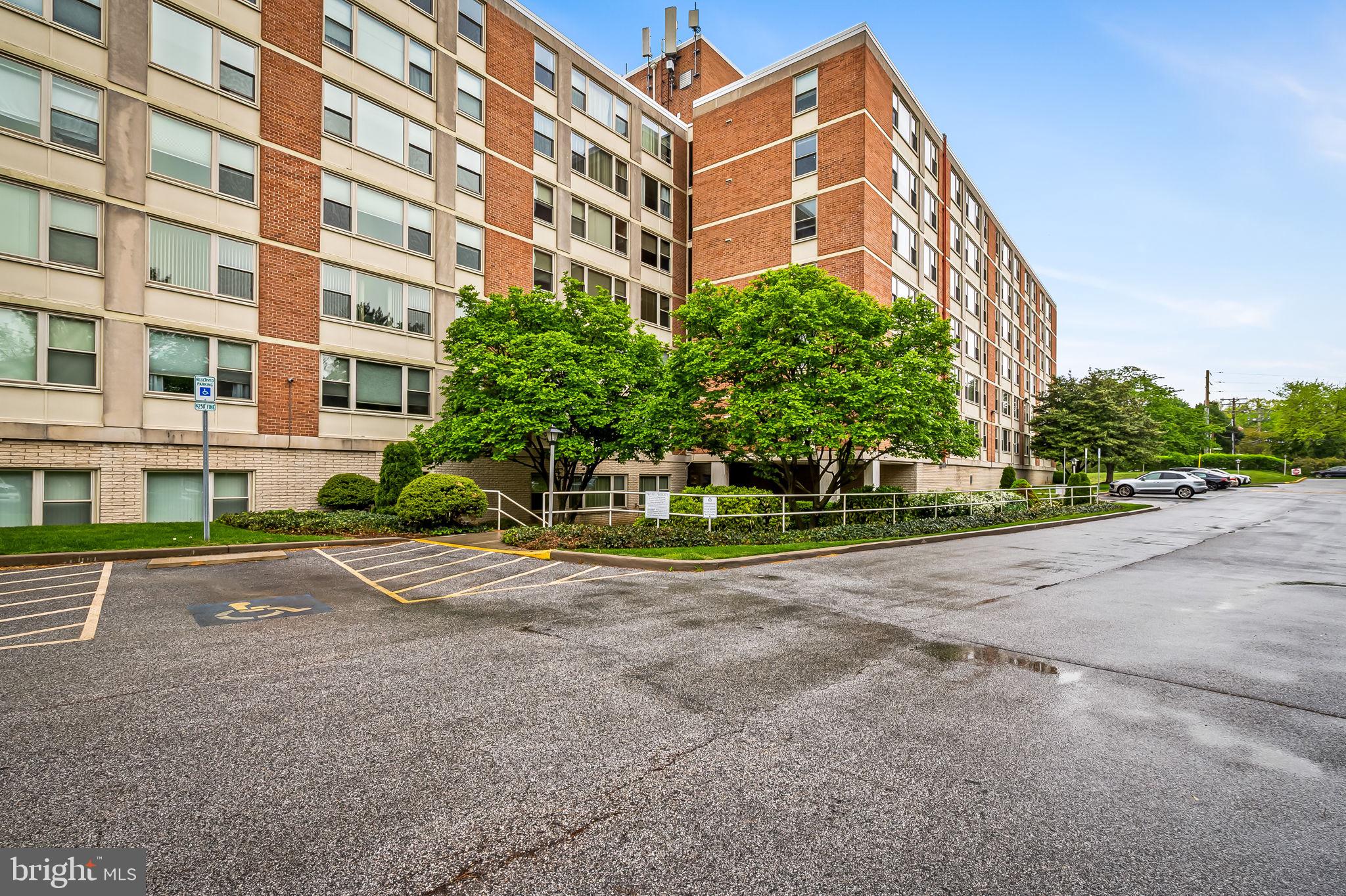 4401 Roland Avenue, Unit 110 Baltimore, MD 21210 - Photo 23 of 23 a view of a tall building next to a road