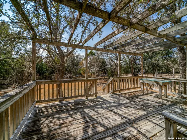 a view of house with backyard and trees
