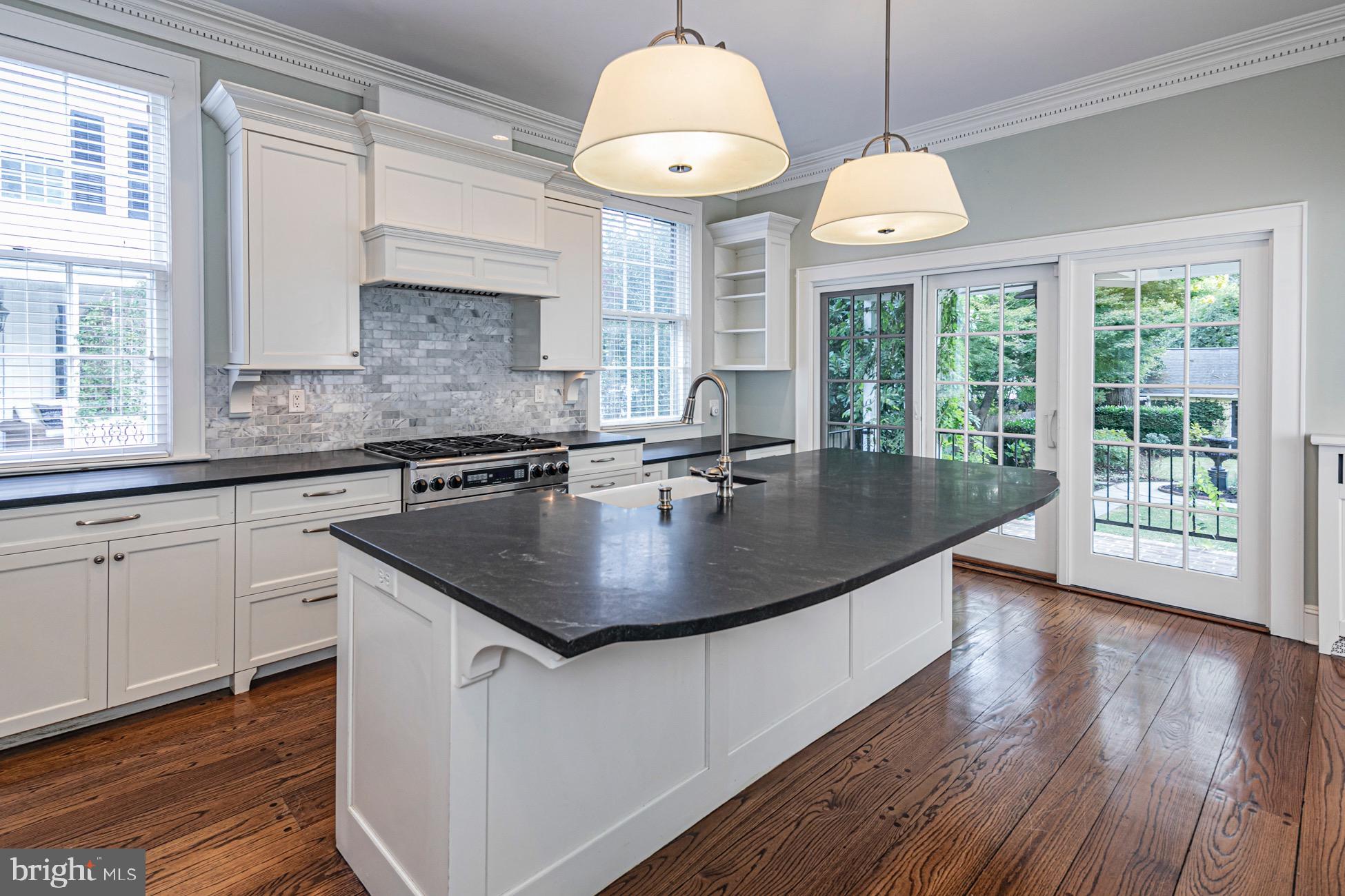 40 Mercer Street Princeton, NJ 08540 - Photo 12 of 35 a kitchen with a sink window and cabinets