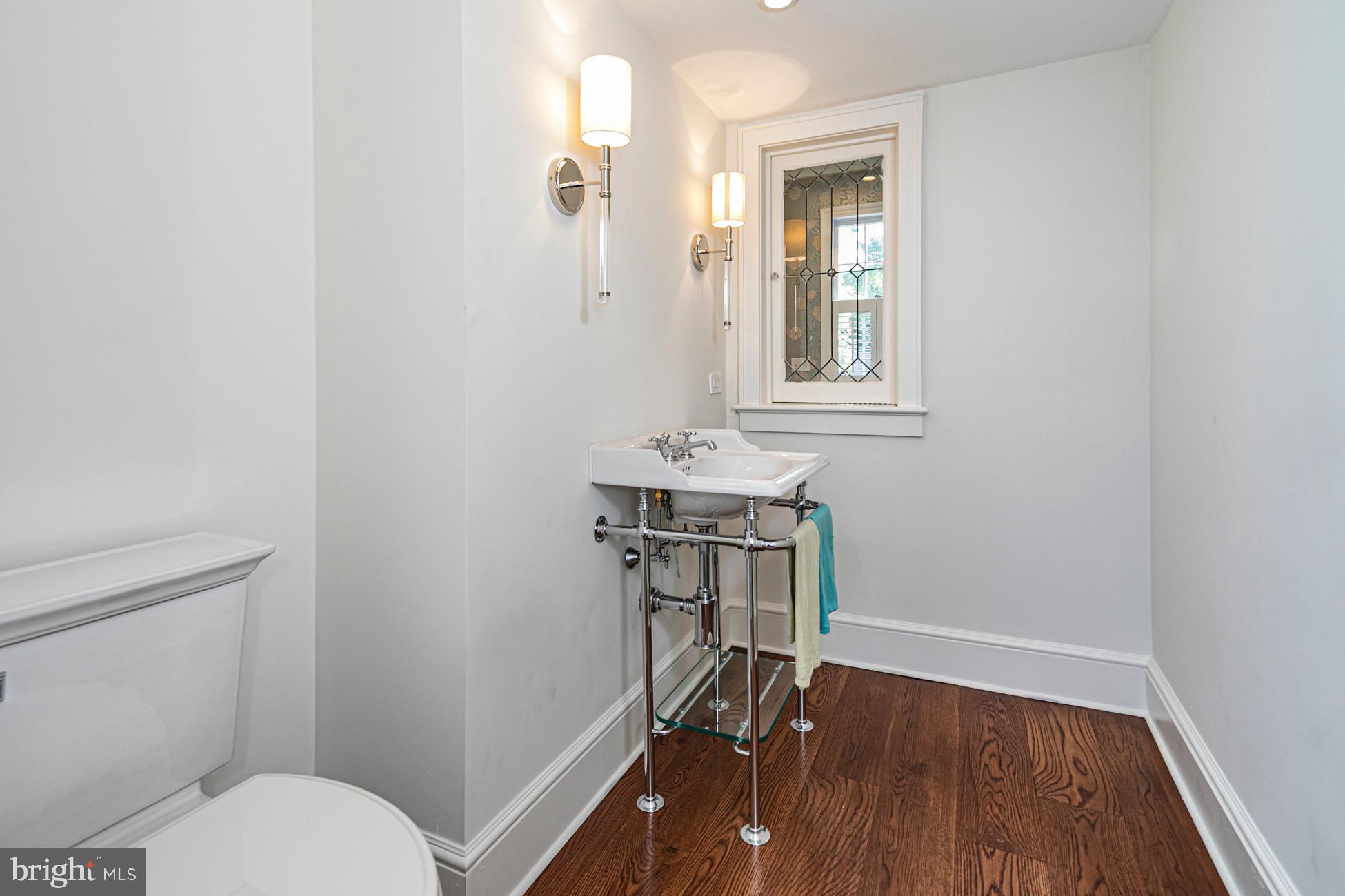 40 Mercer Street Princeton, NJ 08540 - Photo 13 of 35 a bathroom with a toilet a sink and a mirror