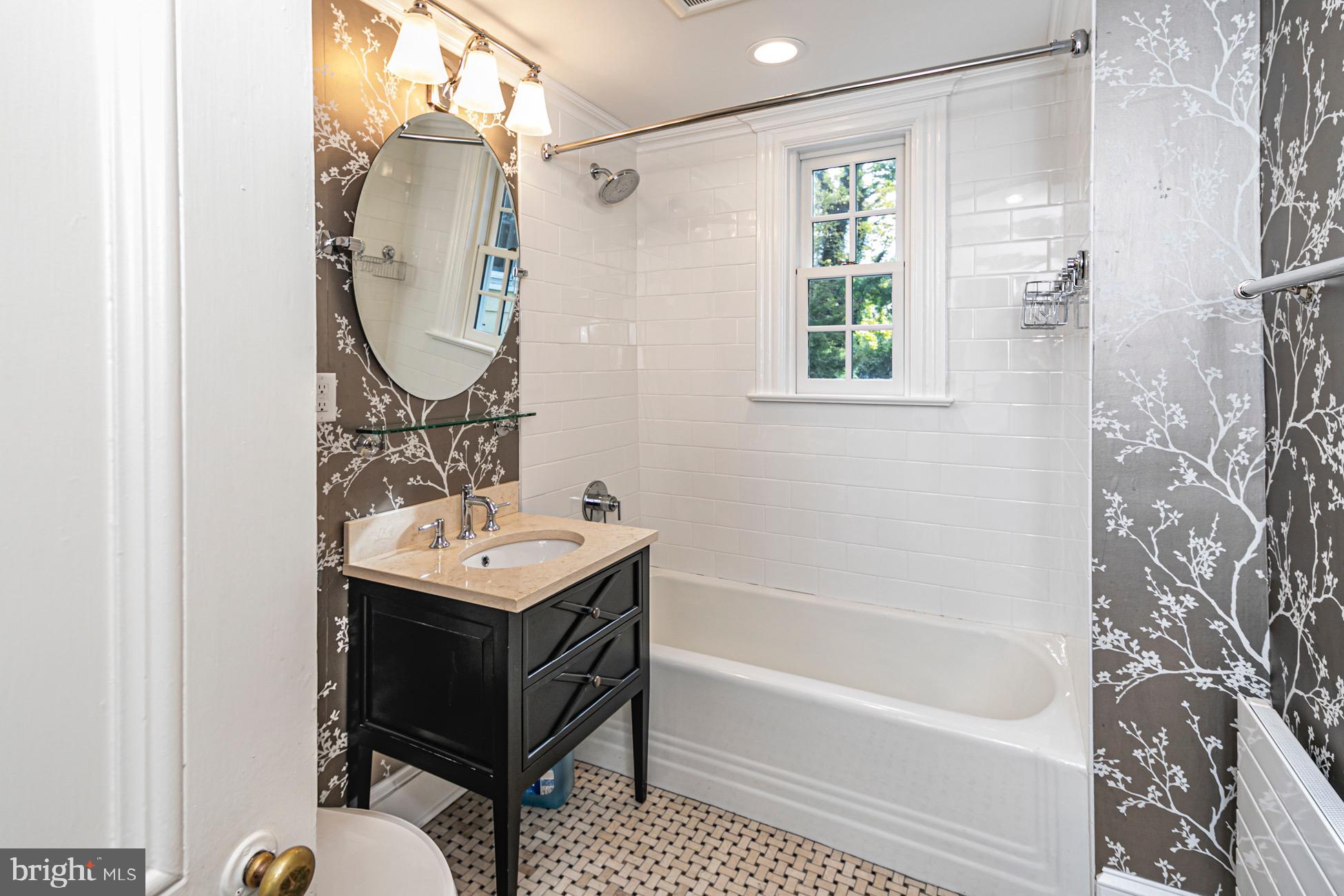 40 Mercer Street Princeton, NJ 08540 - Photo 14 of 35 a bathroom with a sink a bathtub and a mirror