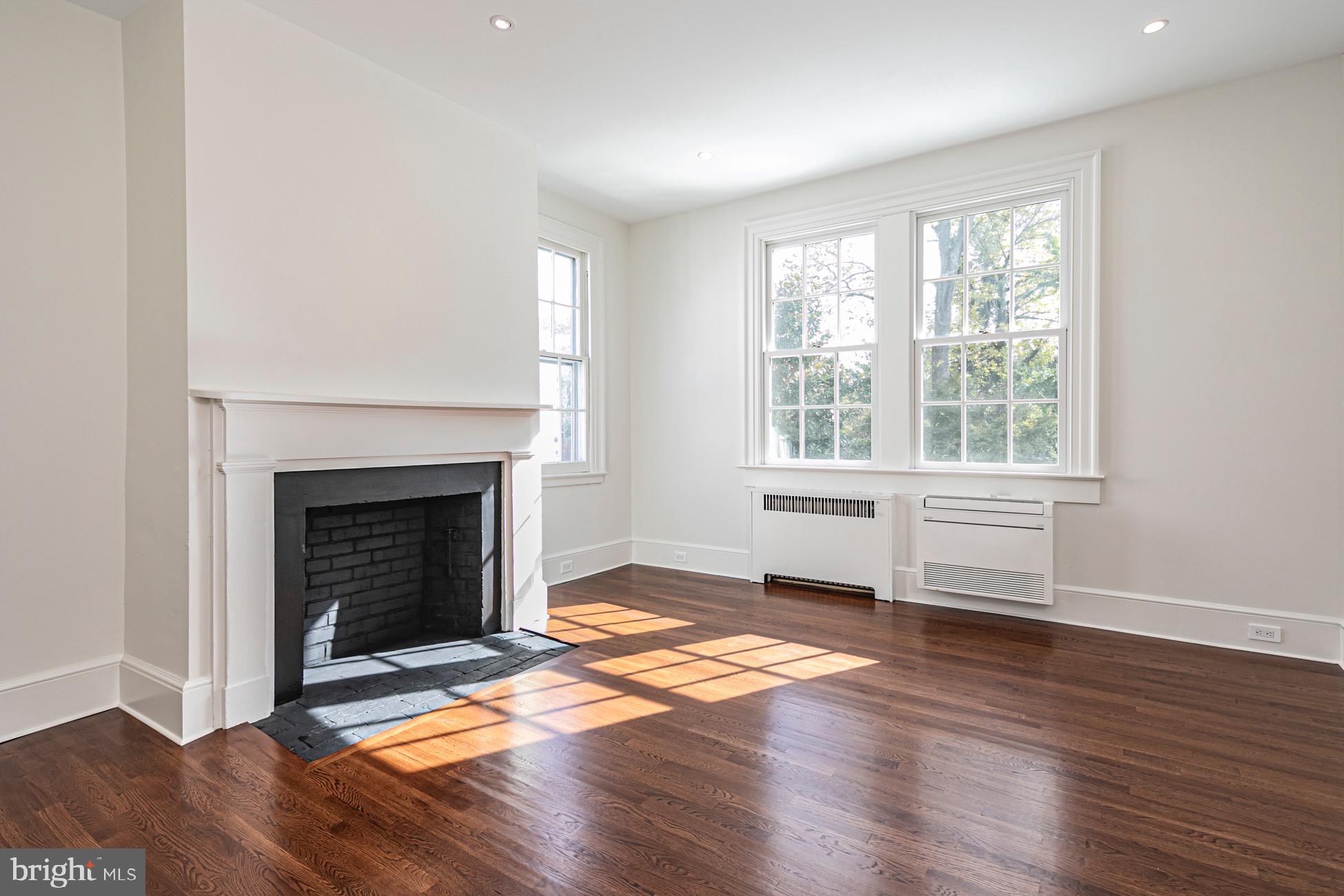 40 Mercer Street Princeton, NJ 08540 - Photo 17 of 35 a living room with a fireplace and wooden floor
