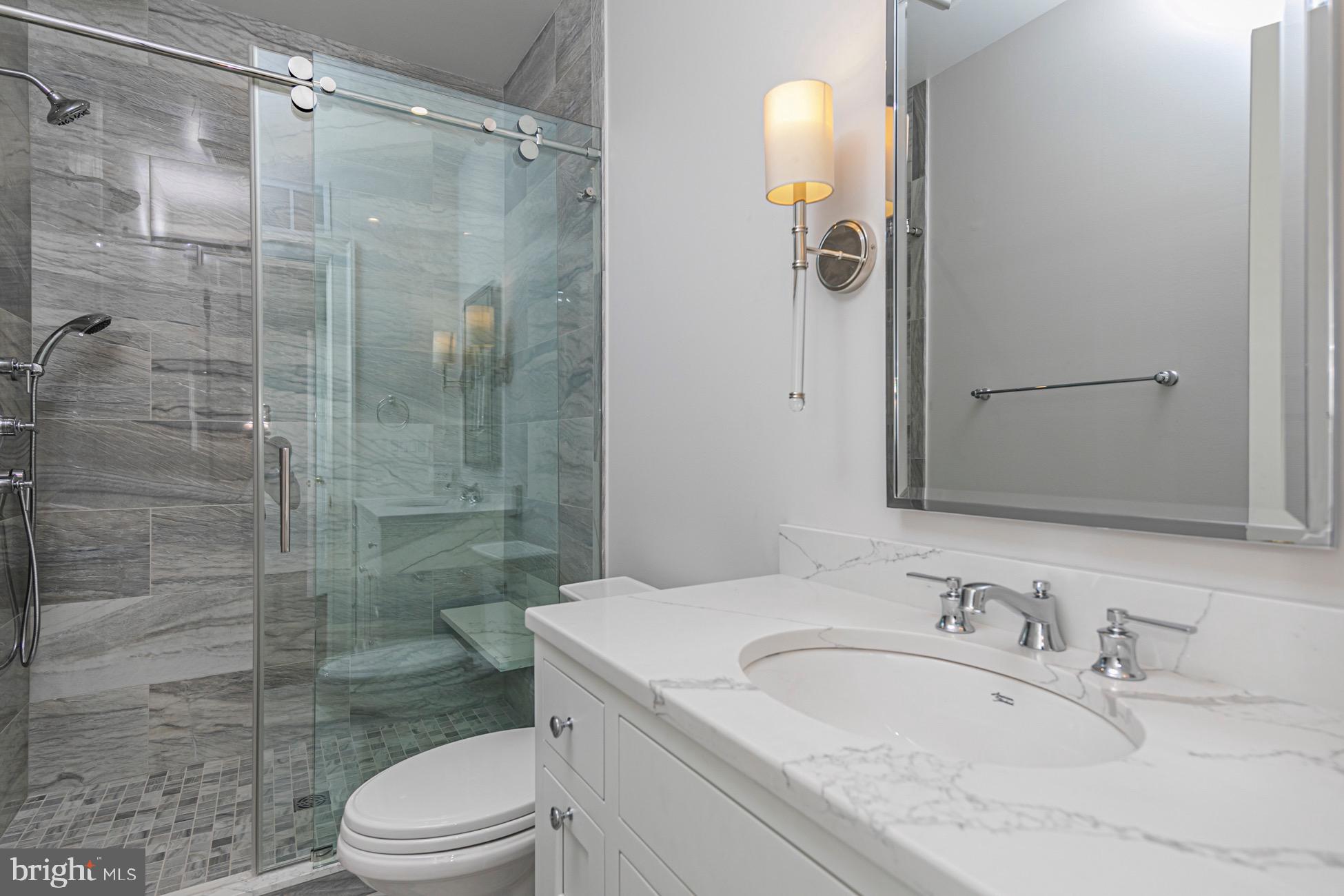 40 Mercer Street Princeton, NJ 08540 - Photo 19 of 35 a bathroom with a sink a toilet and shower