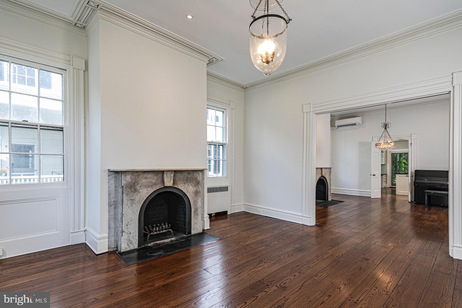 40 Mercer Street Princeton, NJ 08540 - Photo 5 of 35 an empty room with wooden floor fireplace and windows