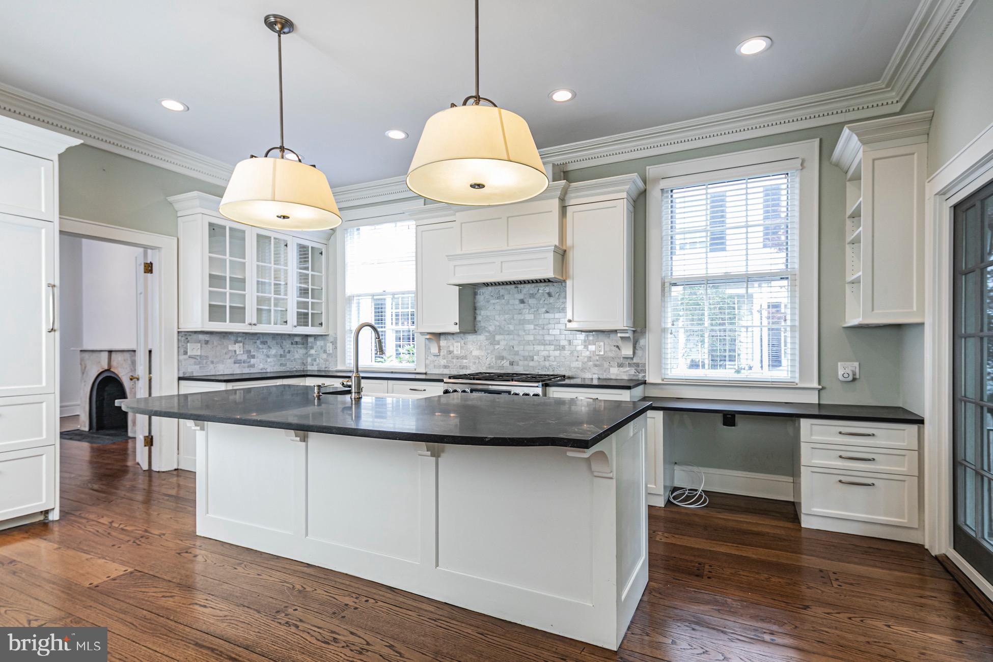 40 Mercer Street Princeton, NJ 08540 - Photo 8 of 35 a kitchen with granite countertop a stove a sink and a chandelier