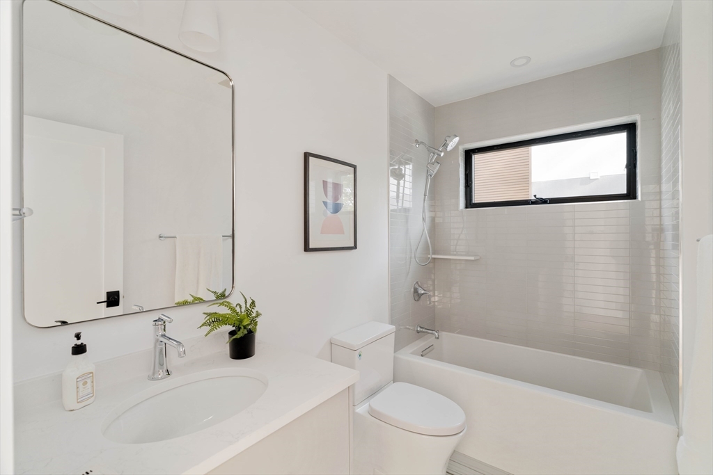 2 Soden Street, Unit 2 Cambridge, MA 02139 - Photo 14 of 38 a bathroom with a sink a toilet and shower
