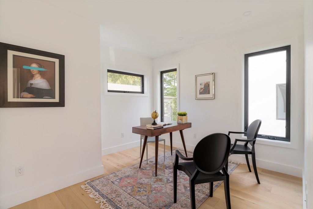 2 Soden Street, Unit 2 Cambridge, MA 02139 - Photo 15 of 38 a view of a workspace with furniture and a potted plant
