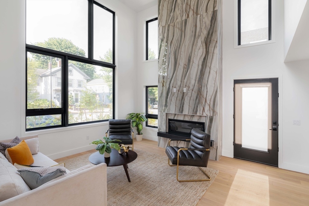 2 Soden Street, Unit 2 Cambridge, MA 02139 - Photo 2 of 38 a living room with furniture and a window