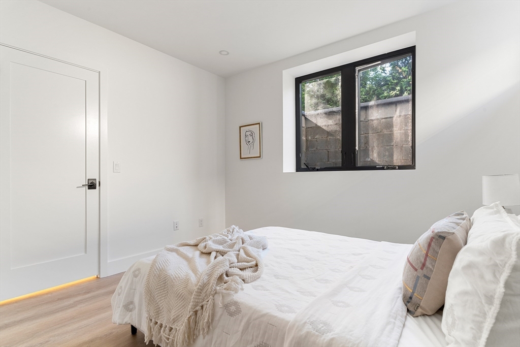 2 Soden Street, Unit 2 Cambridge, MA 02139 - Photo 31 of 38 a bedroom with a bed and a window