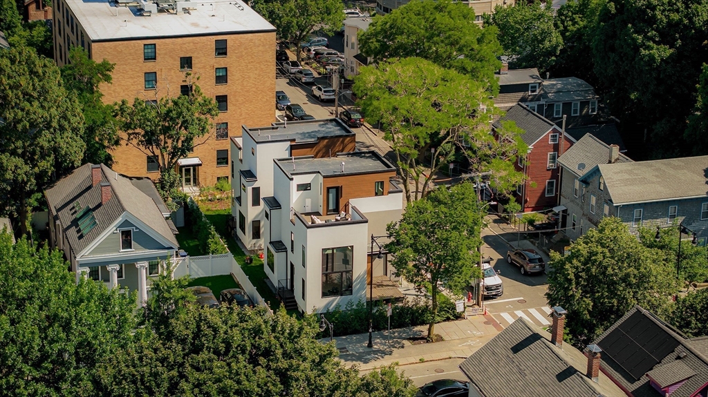 2 Soden Street, Unit 2 Cambridge, MA 02139 - Photo 36 of 38 an aerial view of multiple houses with a yard
