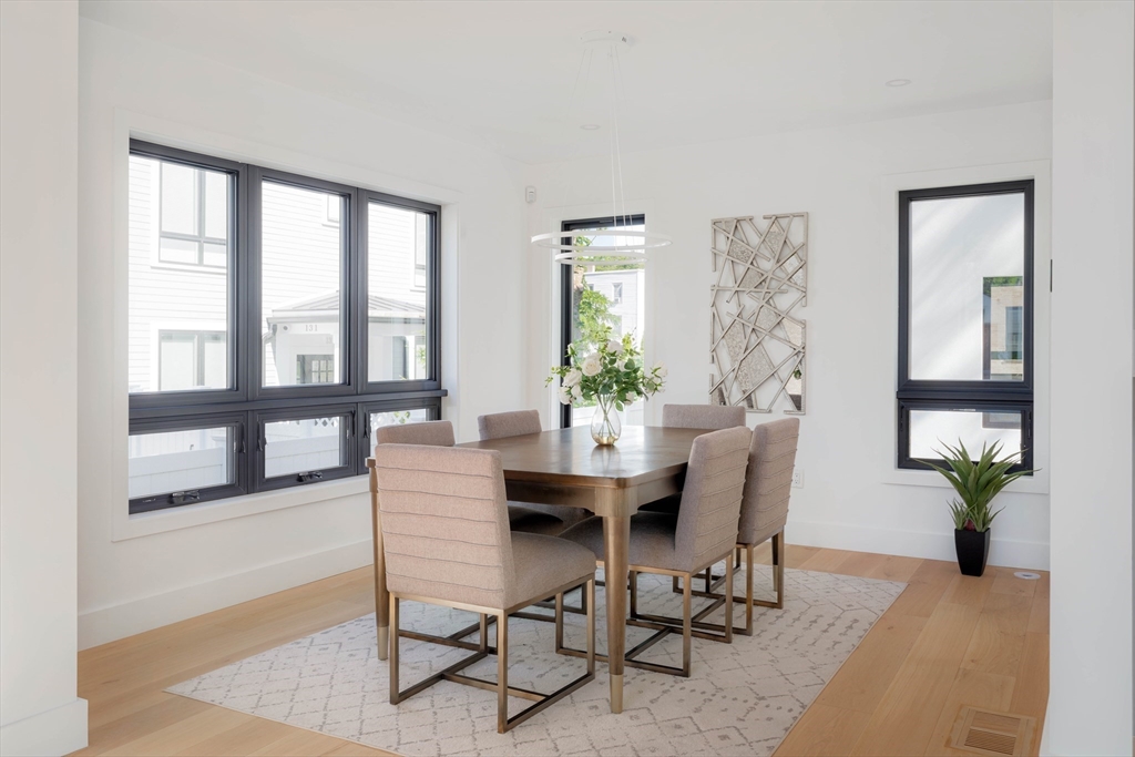 2 Soden Street, Unit 2 Cambridge, MA 02139 - Photo 5 of 38 a view of a dining room with furniture window and wooden floor