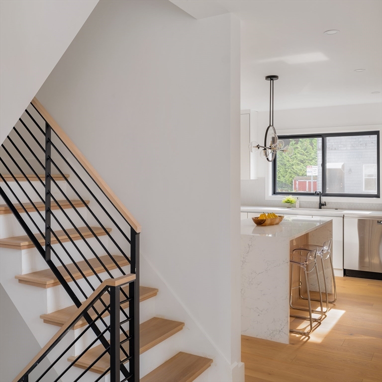 2 Soden Street, Unit 2 Cambridge, MA 02139 - Photo 7 of 38 a view of entryway and hall with wooden floor