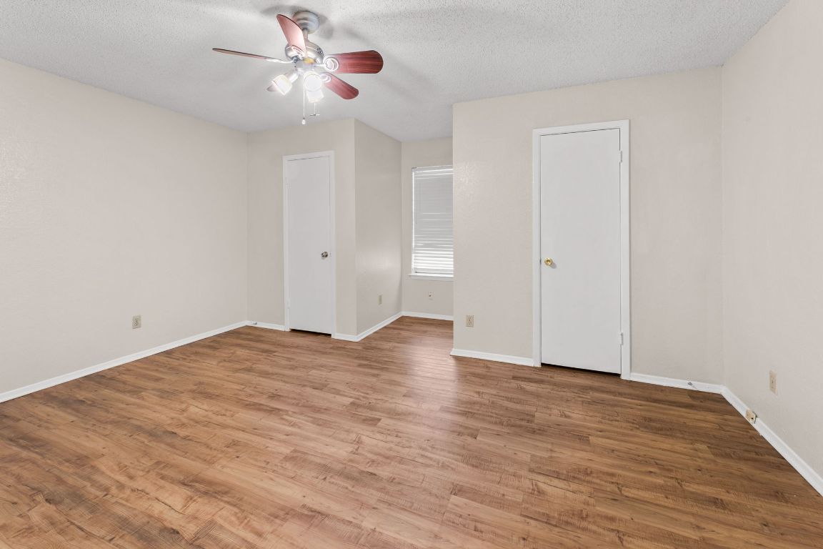 818 Sirocco Drive, Unit B Austin, TX 78745 - Photo 20 of 34 a view of empty room with wooden floor