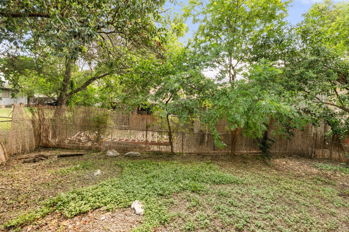 818 Sirocco Drive, Unit B Austin, TX 78745 - Photo 34 of 34 a backyard of a house with lots of green space