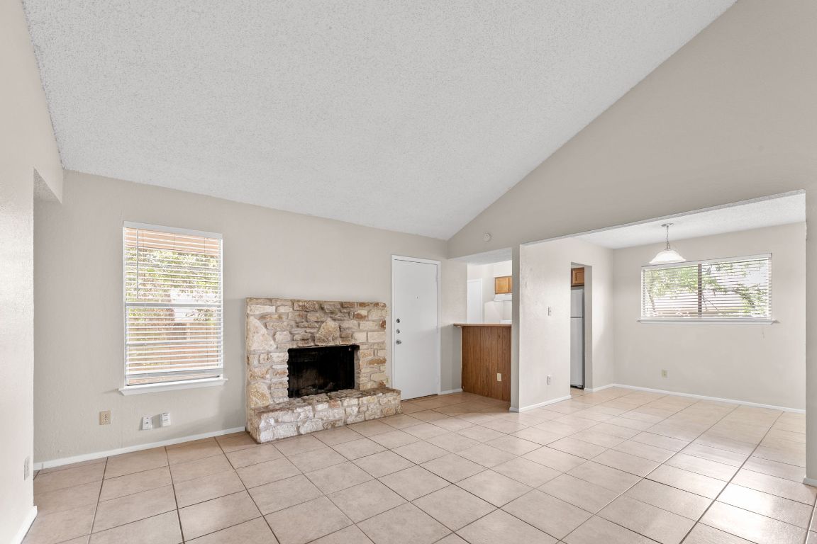 818 Sirocco Drive, Unit B Austin, TX 78745 - Photo 8 of 34 an empty room with windows
