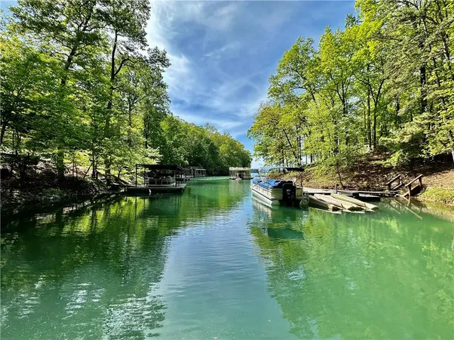 a view of a lake with a house in the background
