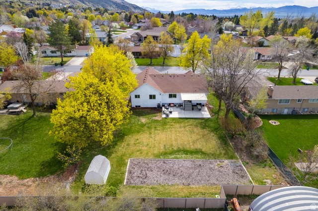 368 Spring Creek Road Providence, UT 84332 - Photo 37 of 45 Aerial perspective of suburban area featuring a mountainous background