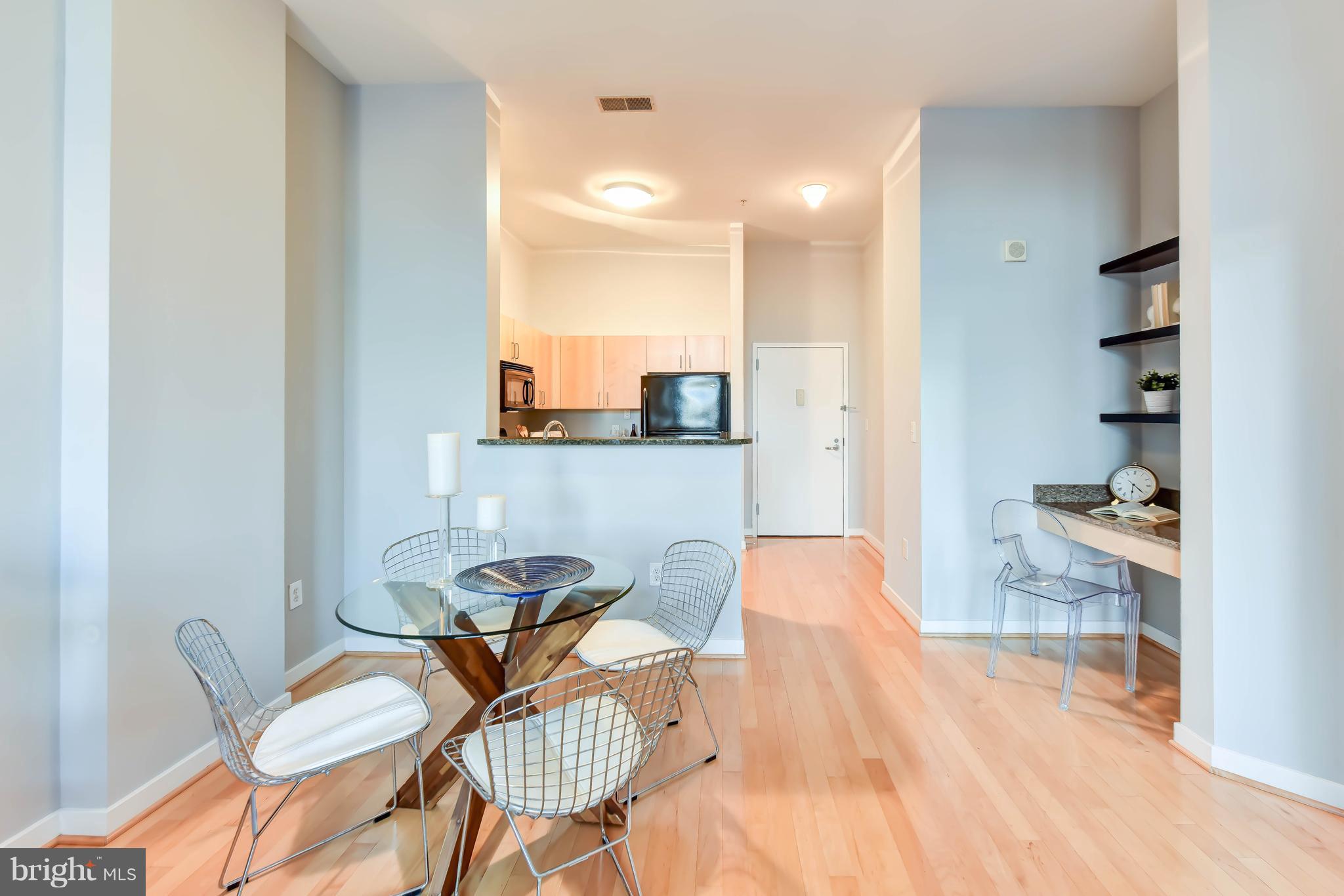 1000 New Jersey Avenue Southeast, Unit 108 Washington, DC 20003 - Photo 4 of 21 a living room with furniture and a wooden floor