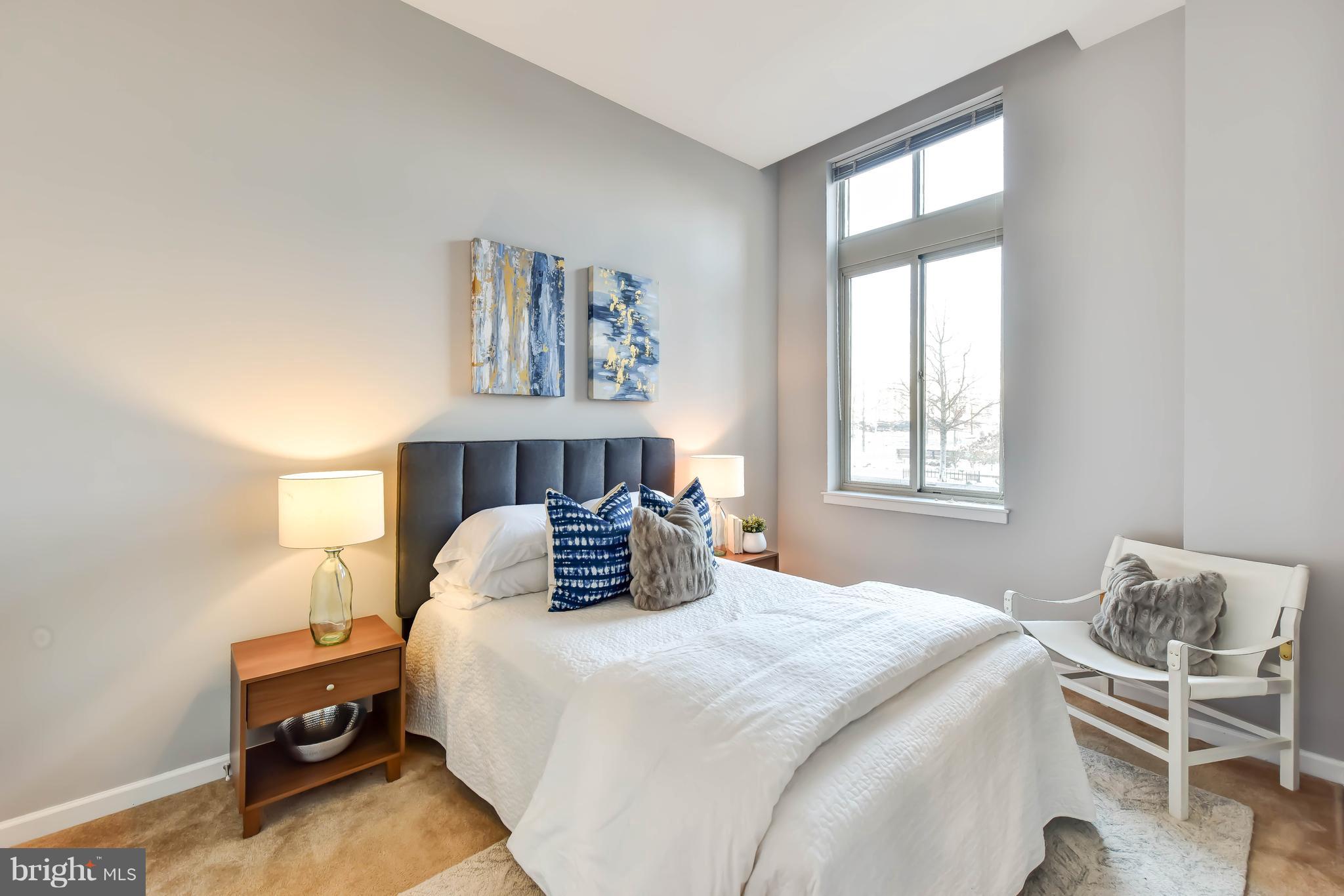 1000 New Jersey Avenue Southeast, Unit 108 Washington, DC 20003 - Photo 6 of 21 a bedroom with a bed and window