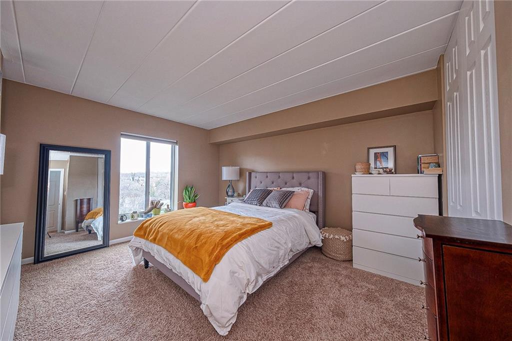 5 Bayard Road, Unit 621 Pittsburgh, PA 15213 - Photo 13 of 38 a bedroom with a bed and a large window